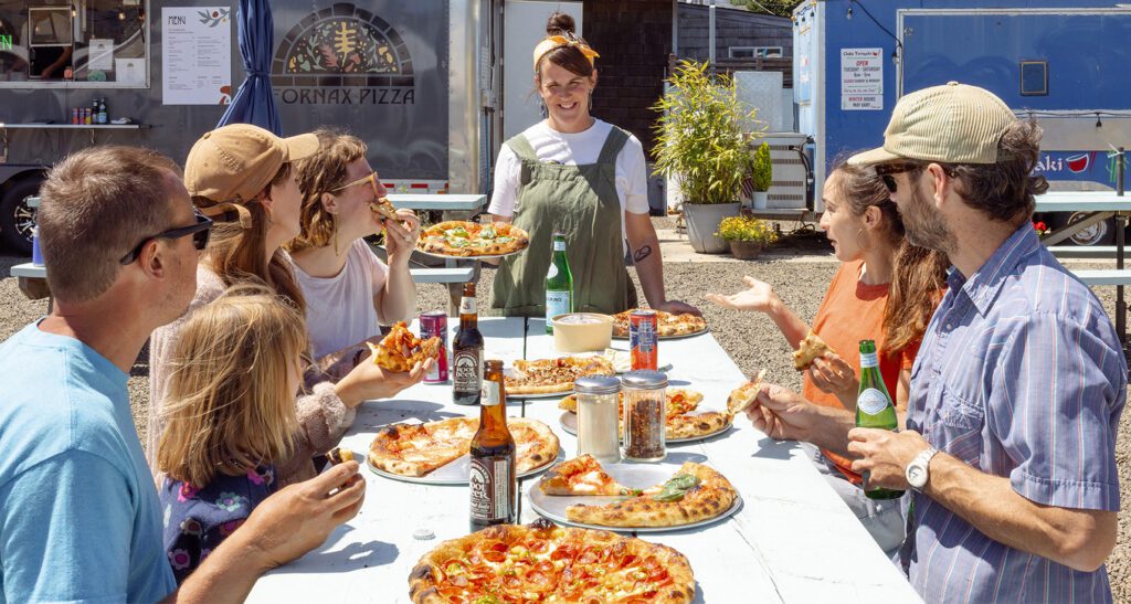Fornax Pizza people picnic table food trucks banner